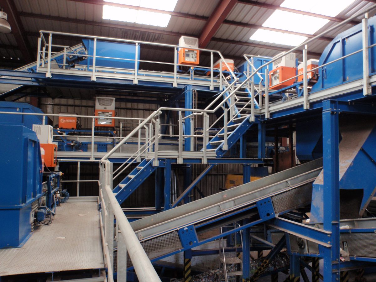 Optical sorting machines and conveyors inside a materials recovery facility